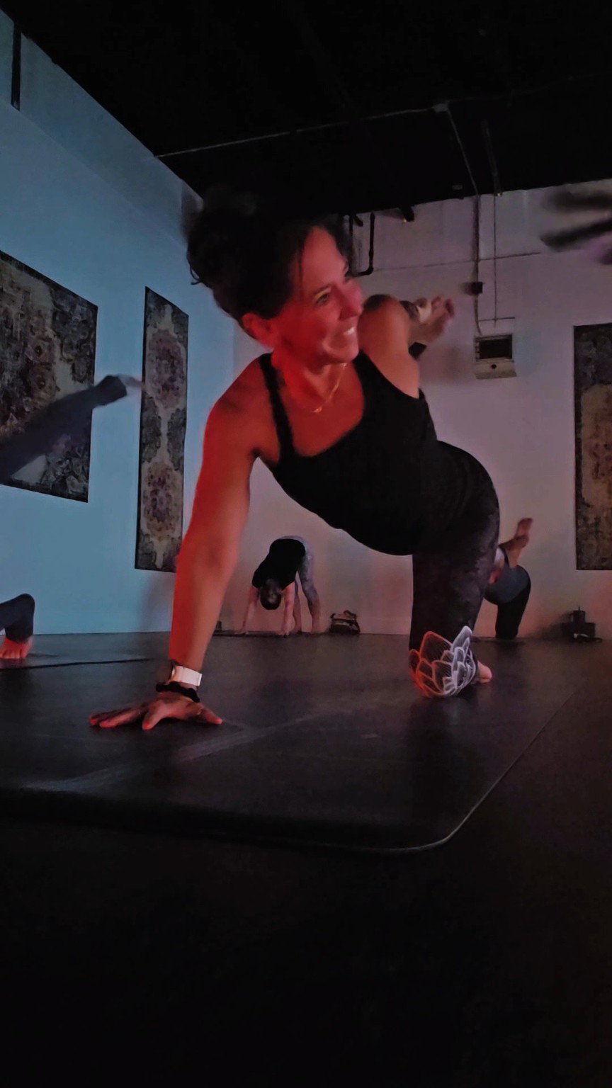 Yoga class in a dark studio